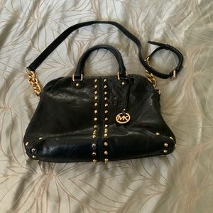 Black leather with gold rivets Michael Kors purse